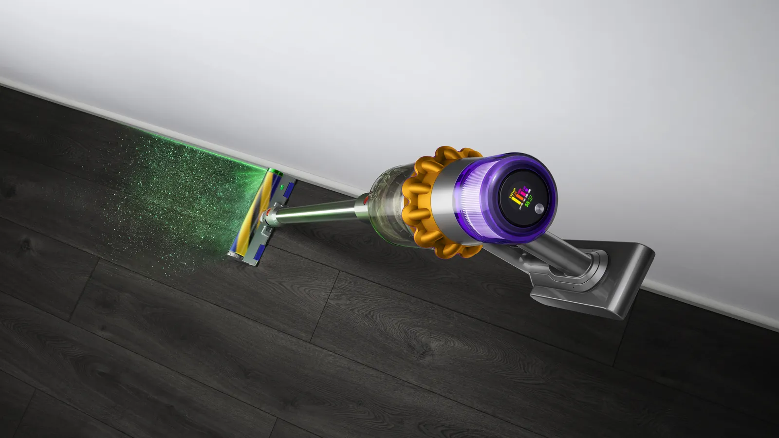 Dyson V15 Detect cordless vacuum cleaner in use on hard floors, the laser is showing particles illuminated.